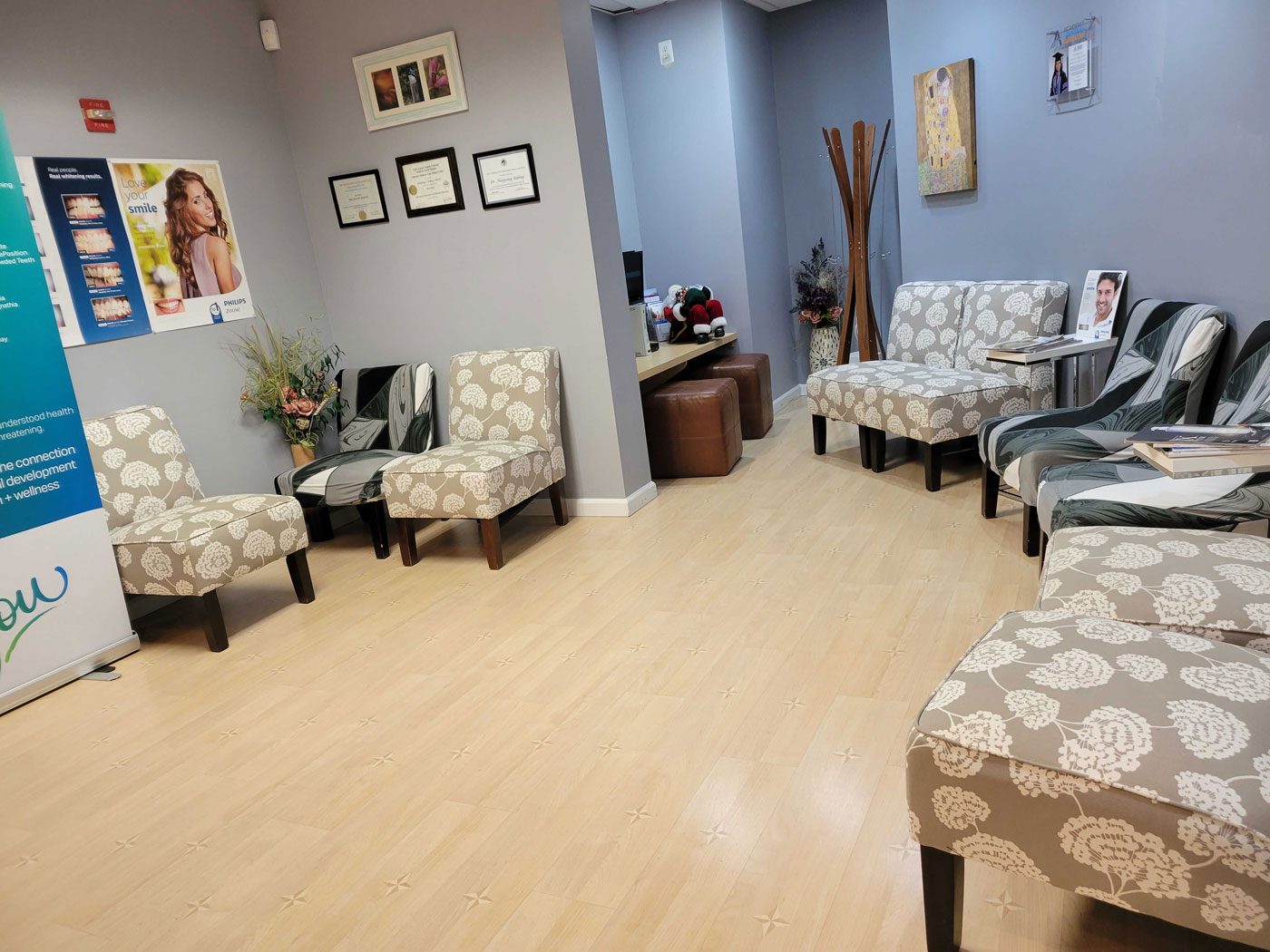 Interior view of JB Dental's office, with a modern and welcoming reception area with comfortable chairs, stylish decor, and a clean, professional atmosphere.